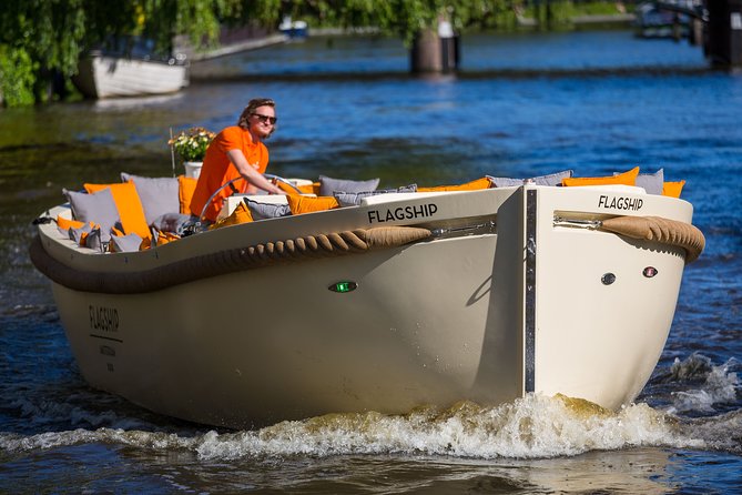 Amsterdam Private BBQ and Drinks Cruise With Onboard Chef - A Protestant church bell tower and the Hermitage branch