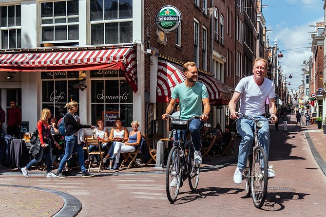 Amsterdam PRIVATE Bike Tour With Locals: Bike & Local Snack Included - Meet-up near Central Station, bike rental, and how the ride begins