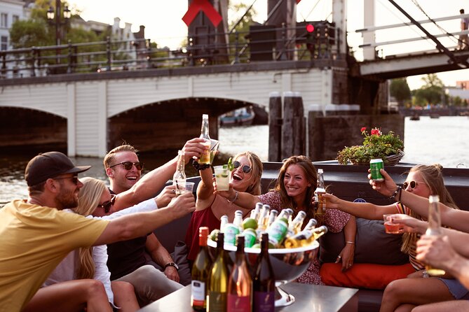 Amsterdam Private Boat Tour with Unlimited Drinks - The 90-minute route: big Amsterdam sights from the canal level