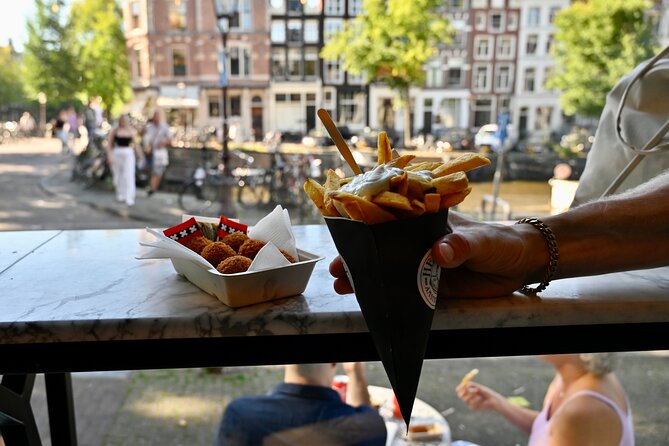 Amsterdam Private Food & Drinks Tour by UNESCO Canals & Jordaan - Jordaan on foot: brown cafés, a secret church garden, and neighborhood food