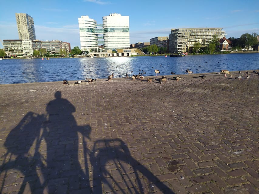 Amsterdam: Rainbow Rural Bike Tour With Local Gay Guide - The centuries-old windmill stop: Dutch waterworks you can see up close