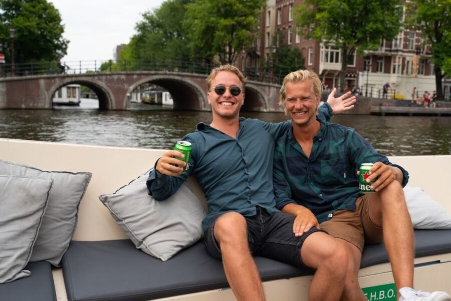 Amsterdam: Red-Light District Pub Crawl and Booze Boat Tour - The booze boat on Amsterdam canals: what you actually get