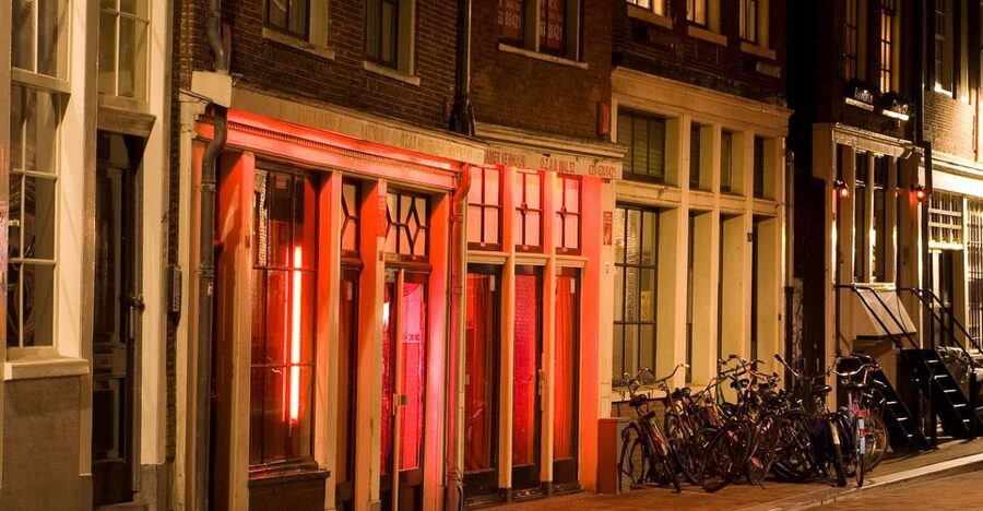 Amsterdam Red Light District tour with a local guide - Seeing the Red-Tinted Windows and How the Street Works