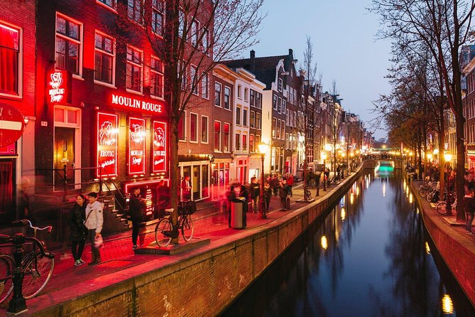 Amsterdam Red Light District Walking Tour in EN/DE/IT/ES - Amsterdam Centraal: legality, window renting, and the money question