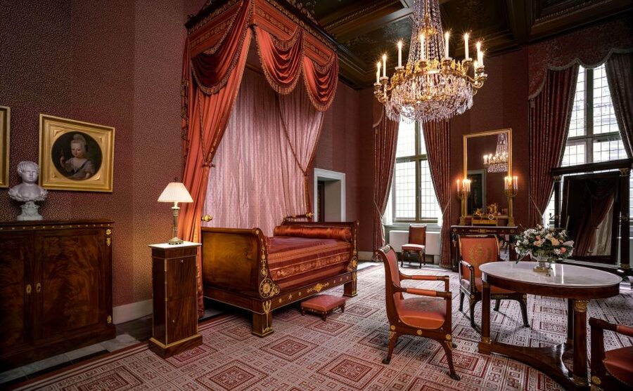 Amsterdam: Royal Palace Entry Ticket and Audio Guide - Louis Napoleon era interiors: clocks, chandeliers, and furniture details