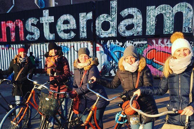 Amsterdam's Hidden Gems and Street Art Bike Tour - The final ferry near Amsterdam Central and Amsterdam’s cycling culture