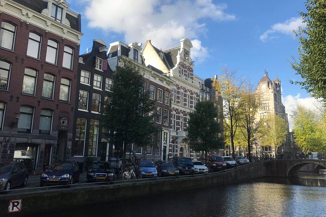 Amsterdam's Unexpected Treasures Private Walking Tour - Canals to St. Nicholas Basilica: old waterfront vibes and local beer stories