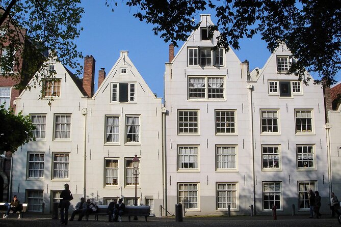 Amsterdam Sightseeing Tour + Hidden Gems + Tastings + PDF guide - Bloemenmarkt floating flowers and the Munttoren angle