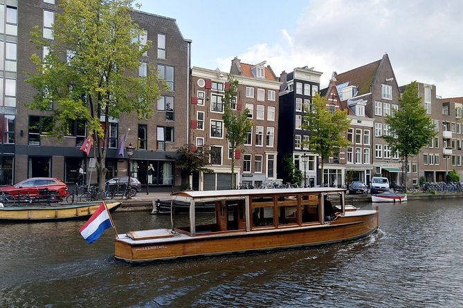Amsterdam small-group canal cruise in 1920s saloon boat - Why a 1928 electric saloon boat changes the vibe