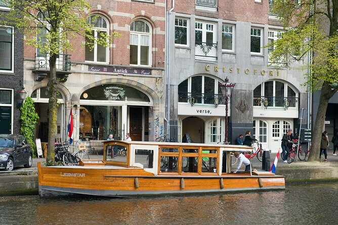 Amsterdam small-group canal cruise in 1920s saloon boat - Covered comfort: heaters, blankets, and real small-group control