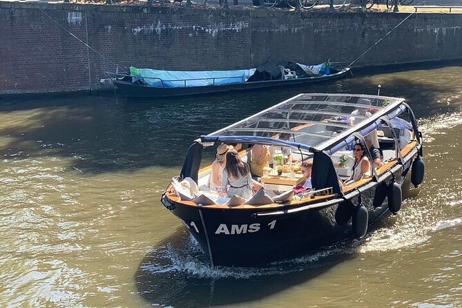 Amsterdam Small-Group Canal Cruise Including Snacks and Drinks - An open electric sloop makes the canals feel up close