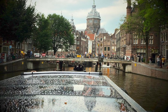 Amsterdam Small-Group Canal Cruise Including Snacks and Drinks - Golden Age ships and the Hortus Botanicus angle