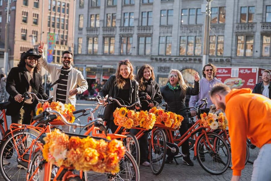 Amsterdam: Top Highlights Guided Bike Tour EN/DE/ES/FR/IT/CN - Passing Through the Red Light District: See It Without Turning It Into a Detour