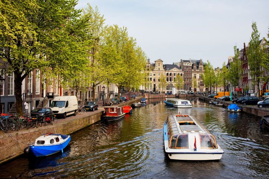 Amsterdam Walking Tour and Canal Cruise - Jordaan Walk: One Neighborhood, Many Real Details