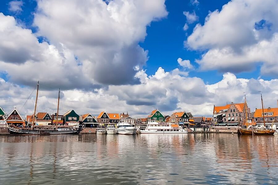 Amsterdam: Zaanse Schans, Edam, Volendam & Marken Bus Tour - Volendam: Colorful Streets, Fishing Boats, and Shopping Time