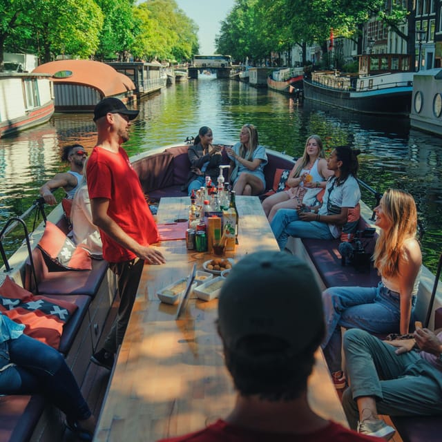 COZY AND FUN CANAL TOUR: A UNIQUE JOURNEY THROUGH AMSTERDAM - Munttoren and Grimburgwal, finishing in the canal maze