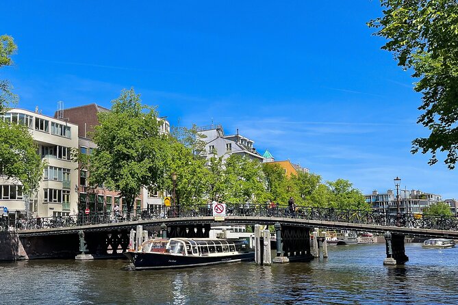 Discover Amsterdam: Luxury Canal Cruise with a Local Skipper - A 75-minute cruise that gets your Amsterdam bearings fast
