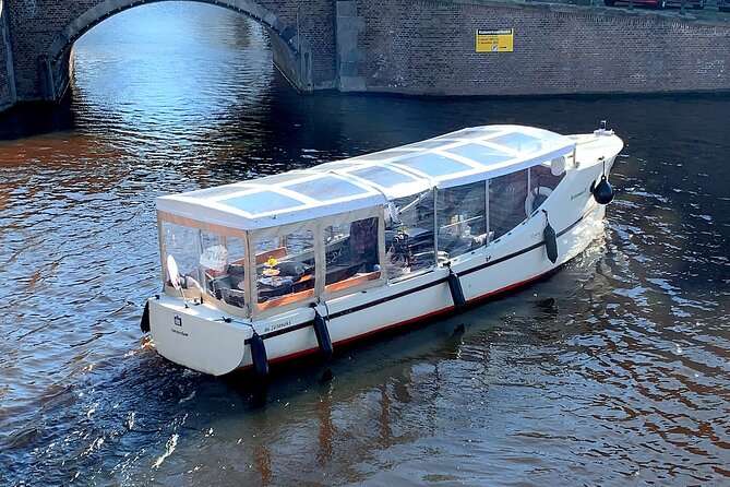 Dutch Cheese & Drinks Guided Amsterdam Boat Tour, All Inclusive - Oude Kerk and the Red Light District setting you will recognize