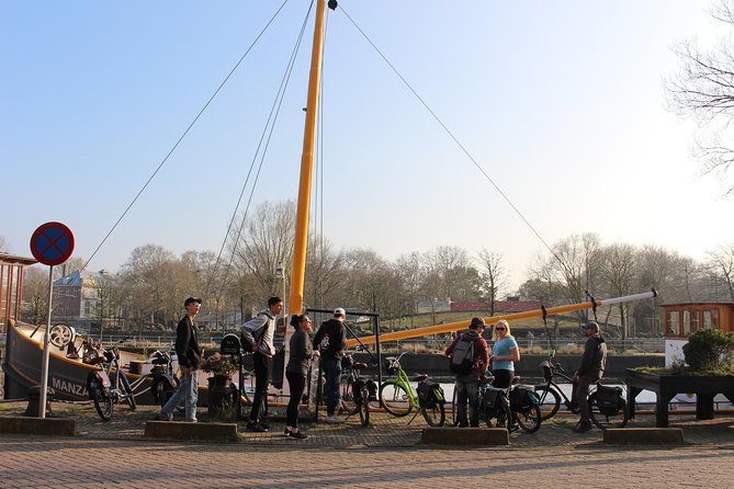E-Bike Tour, Amsterdam's Highlights and Hidden Gems - Museum Square and the Rijksmuseum cycle-under moment