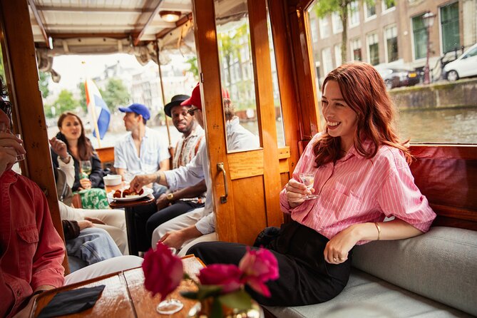 Eating Amsterdam: Food Tour & Canals Cruise - Walking the canals with Golden Age stories and WWII context