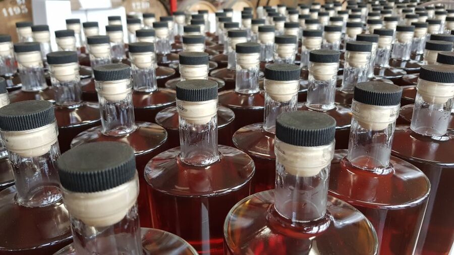 Eindhoven: Bottle Distillery Tour and Tasting Experience - Check in at the front desk, then meet the guide behind the bar