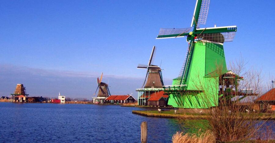 From Amsterdam: Small Group Zaanse Schans and Volendam Tour - Zaanse Schans windmill village: clogs, cheese, and Dutch craft stops