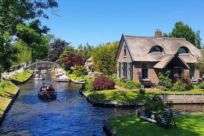 Giethoorn Day Tour from Amsterdam with Small Boat Ride - The calm rhythm of Giethoorn: car-free streets and village-scale views