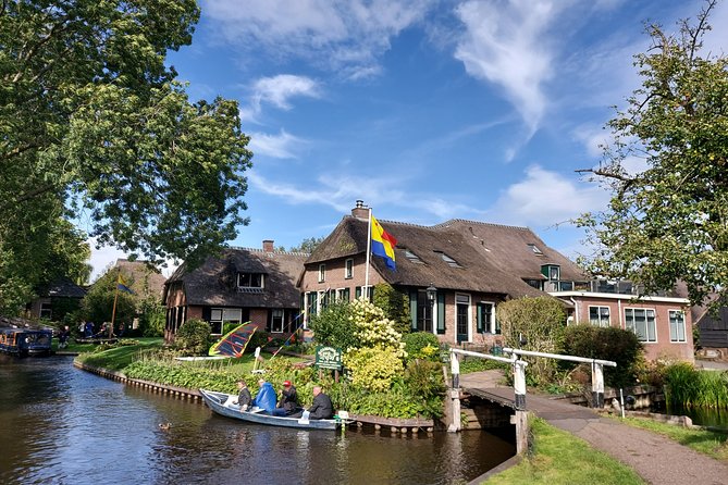 Giethoorn Small-Group Tour from Amsterdam (Max. 8 People) - Walking Giethoorn village for 1.5 hours, with optional guided stories