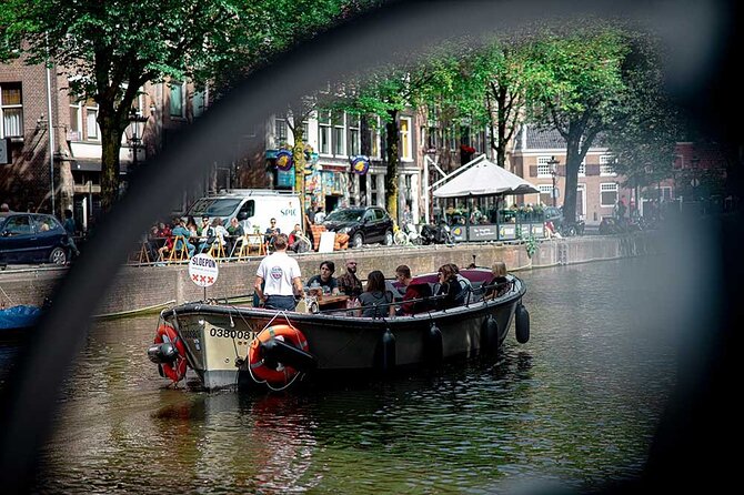 Guided Amsterdam Canal Cruise – Snacks & Drinks on board(1 Hour) - East India Company roots and a futuristic ship-shaped view from the water
