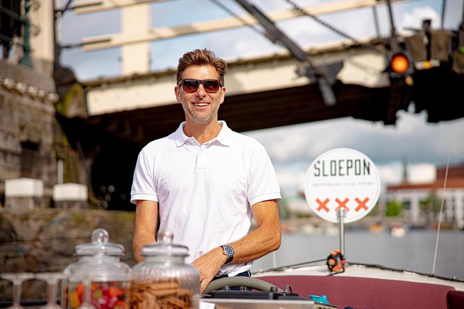 Guided Amsterdam Canal Cruise – Snacks & Drinks on board(1 Hour) - Jewish cultural heritage, a calm green canal corner, and Herengracht mansions