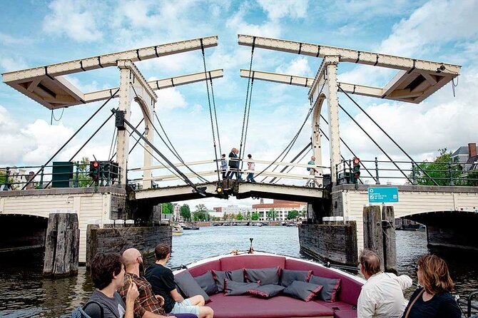 Guided Amsterdam Canal Cruise – Snacks & Drinks on board(1 Hour) - Seven arch bridges, the lovers’ drawbridge, and crooked houses on poles