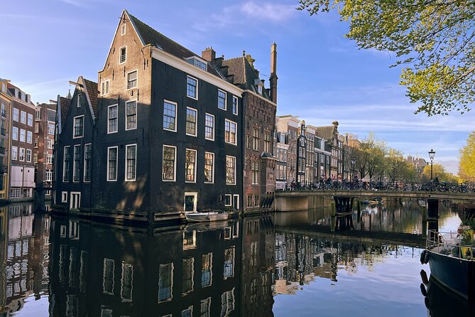 Historical Walking Tour, private with local Dutch guide - Het Kleinste Huis and Dam Square: micro-details and the city heart