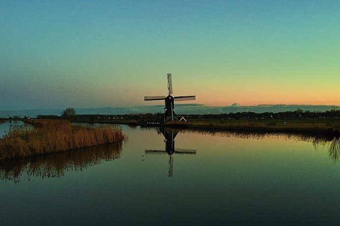 Kinderdijk Photography tour - Walking the Windmill Grounds: Ducks, Reeds, and Changing Water Levels