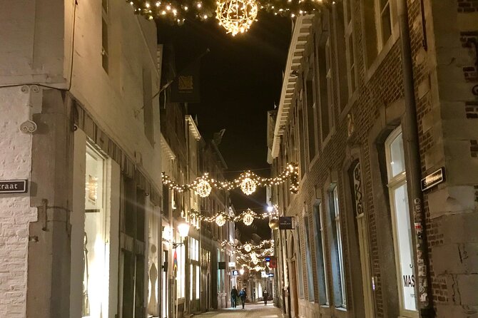 Maastricht Evening Sightseeing Tour - Vrijthof Square at Dusk: Lights, Market Setup, and the Icy Fun