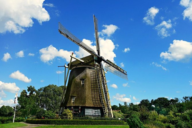 Private Half-Day Sightseeing Tour in Amsterdam - The Amstel River windmill photo and Magere Brug’s love story