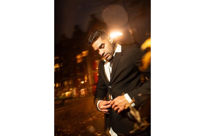 Private Photo Session in Amsterdam - Starting at Damrak 13-15, in Front of the Dancing Houses