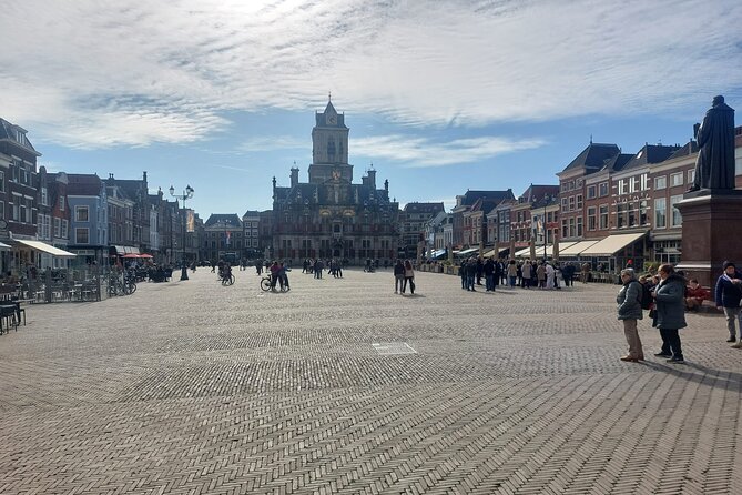 Private Tour of Delft + Visit to Delft Blue Museum & Factory - Oude Delft canal and the Gemeenlandshuis facade clues