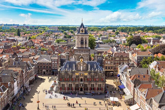 Private tour to Kinderdijk windmills and Delft from Amsterdam - Delft canals and churches: time for Vermeer, William of Orange, and a calm town pace