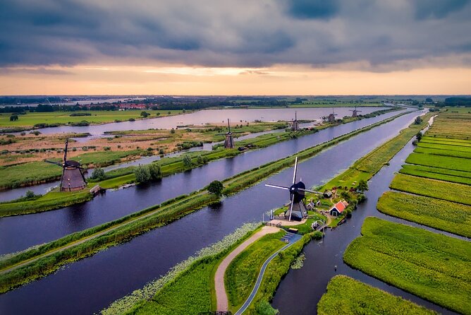 Private tour to Kinderdijk windmills and Delft from Amsterdam - Kinderdijk UNESCO windmills: 19 originals, pumps, and a boat view