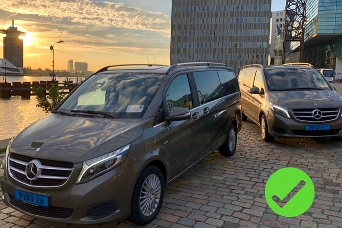 Private transfers from or to Schiphol (AMS) airport Amsterdam - Finding your driver in Schiphol main hall, with a real welcome sign