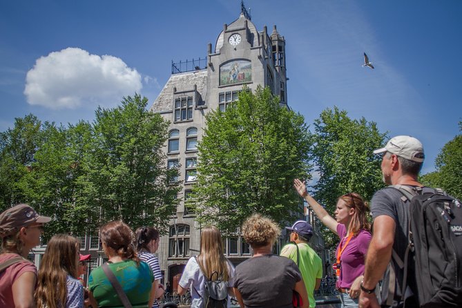 Secrets of Amsterdam Walking Tour plus Dutch Sweets Tasting - Royal Palace, Dam, and the New Church: the fast origin story