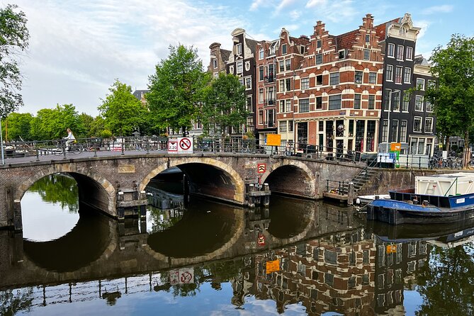 Small Group Walking Tour in Amsterdam with Friendly and Fun Guide - Dam Square and Damstraat: the “how it all began” moment