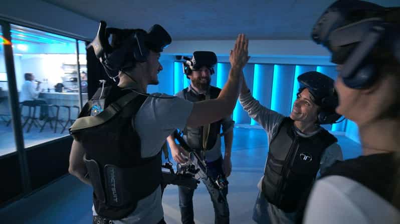 The Hague Downtown: VR Zombie Shooter 2 - 4 people - Free-walk VR arenas and the role of haptic vests