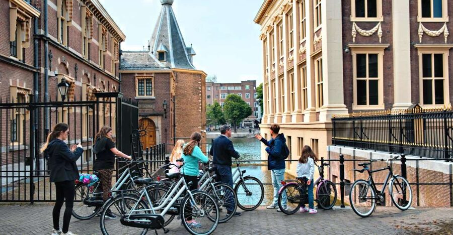 The Hague: Highlights Bike Tour - Rain-ready cycling: poncho help and practical safety
