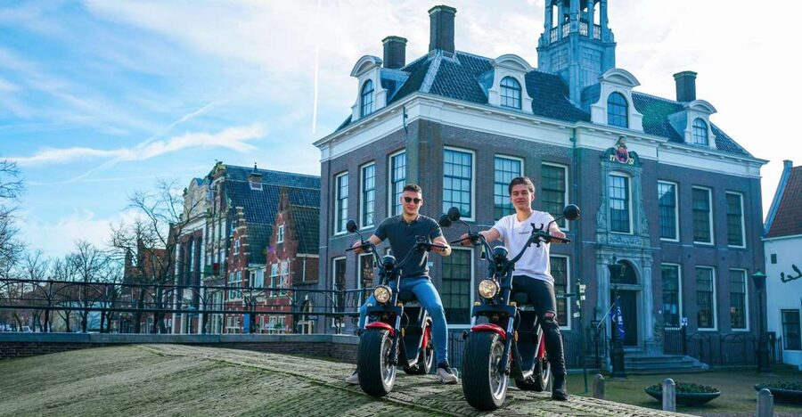 Volendam: E-Scooter Rental - Monnickendam: Bronze Brick Charm, Harbor Terraces, and Brewery Flavor