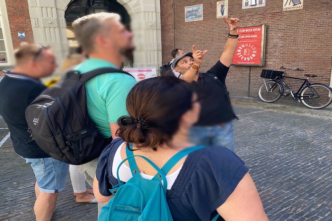 Zen Amsterdam Tour : Alternative History and High Experiences - Amsterdam Museum exterior symbols: the flag’s strange mark explained